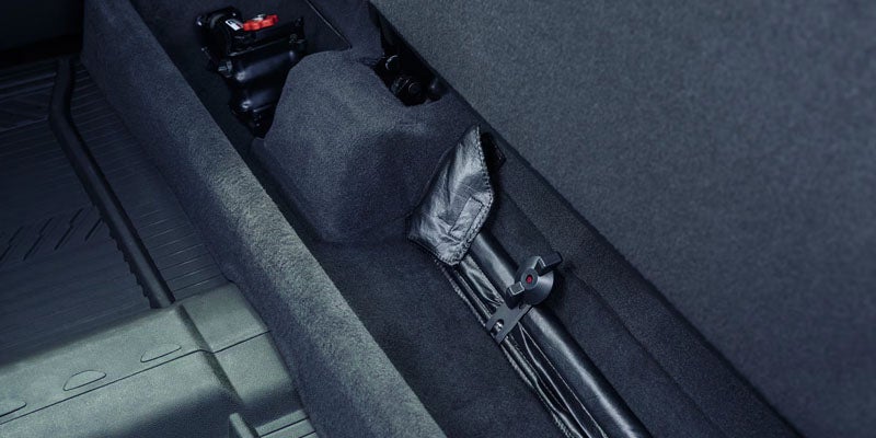 View of the 2025 Chevy Silverado's front dashboard from the front passengers point of view. Steering wheel, temperature controls, and touch screen are visible.