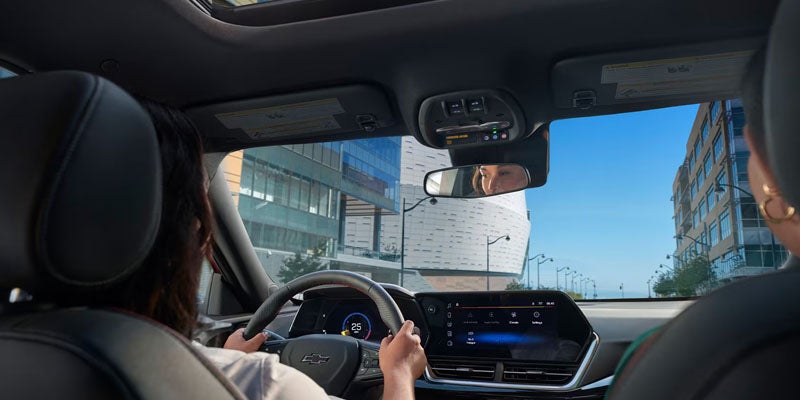 Front view of the 2025 Chevy Trax with a body of water in the background.